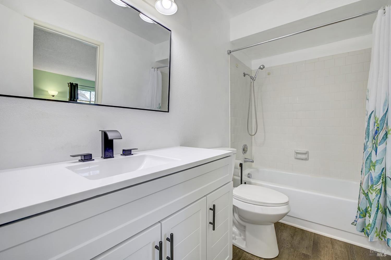 870 Hudis Street Rohnert Park, CA 94928 - Photo 24 of 49 a bathroom with a sink toilet vanity and shower