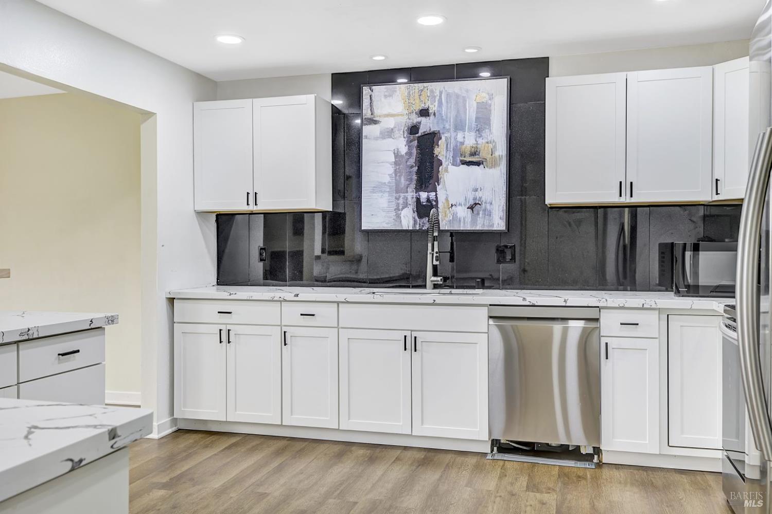 870 Hudis Street Rohnert Park, CA 94928 - Photo 8 of 49 a kitchen with stainless steel appliances granite countertop a sink and cabinets
