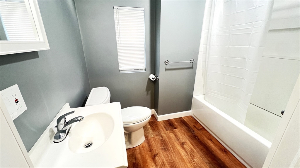 31 Ridgeway Street, Unit 1 Lynn, MA 01902 - Photo 12 of 16 a bathroom with a sink and toilet