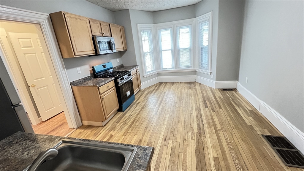 31 Ridgeway Street, Unit 1 Lynn, MA 01902 - Photo 3 of 16 a view of a kitchen from the windows