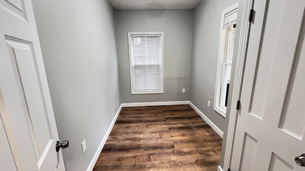 31 Ridgeway Street, Unit 1 Lynn, MA 01902 - Photo 10 of 16 wooden floor with window