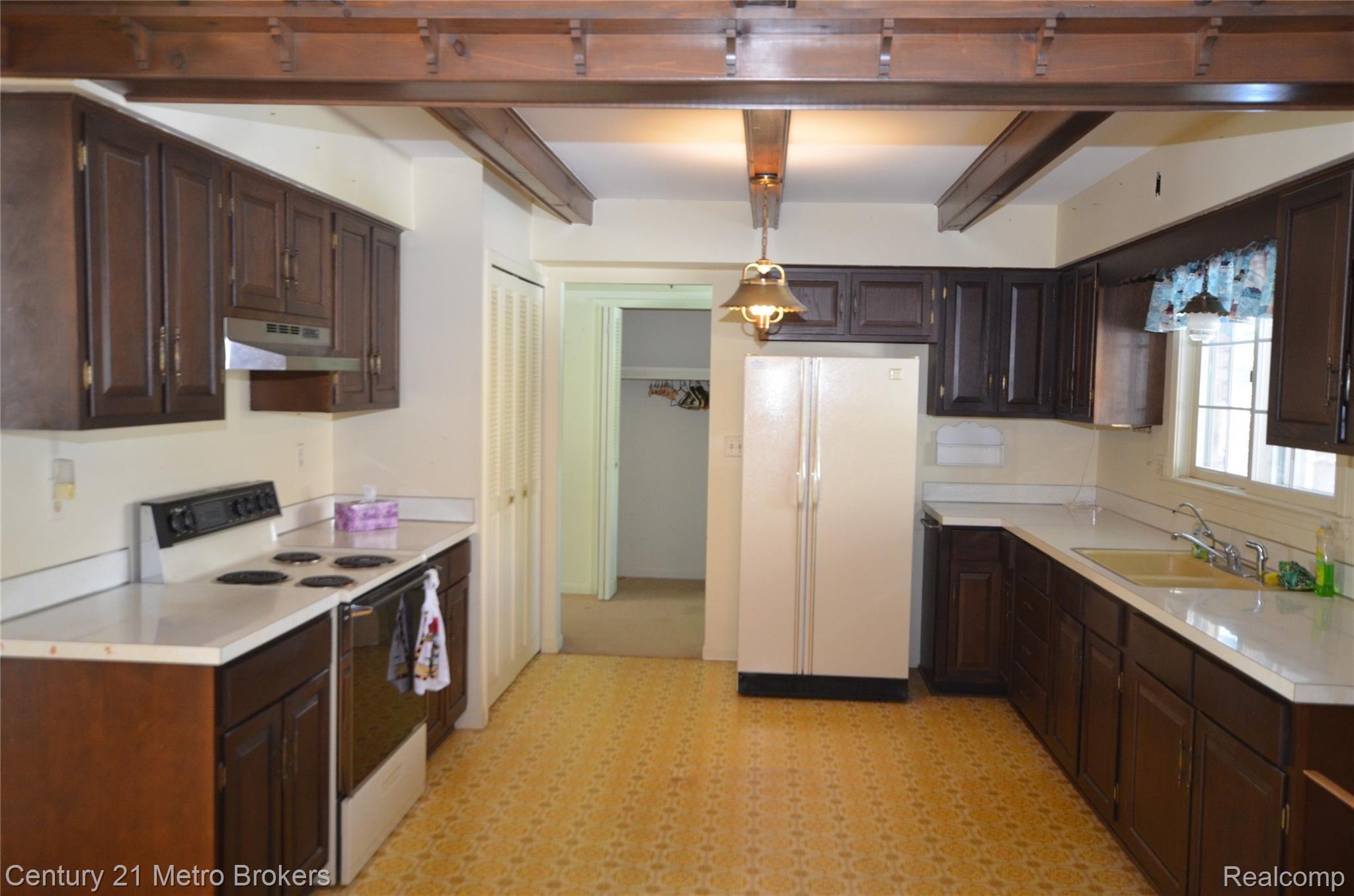 12601 Holtforth Road Fenton, MI 48430 - Photo 12 of 25 kitchen area , picture taken from the dining area where fireplace is located