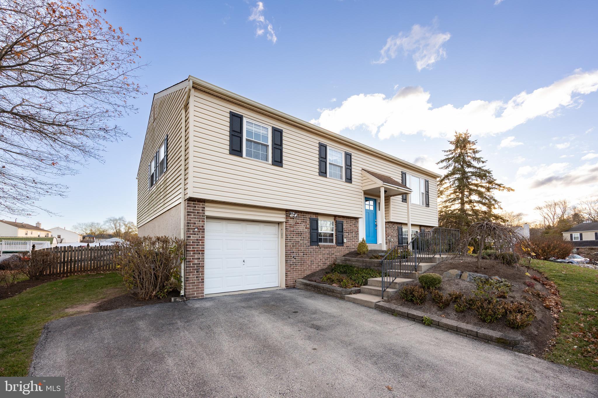 5 Cheyenne Road Royersford, PA 19468 - Photo 4 of 29 a front view of a house with a yard and garage