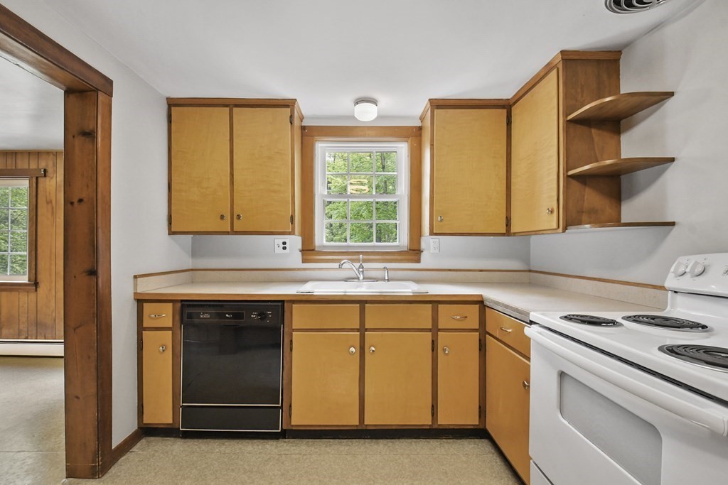 167 Ashby Road New Ipswich, NH 03071 - Photo 15 of 30 a kitchen with a sink stove and cabinets