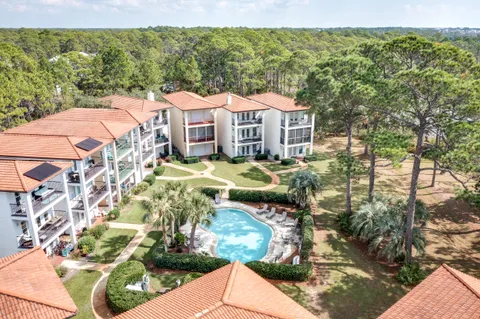 a aerial view of a house with a yard