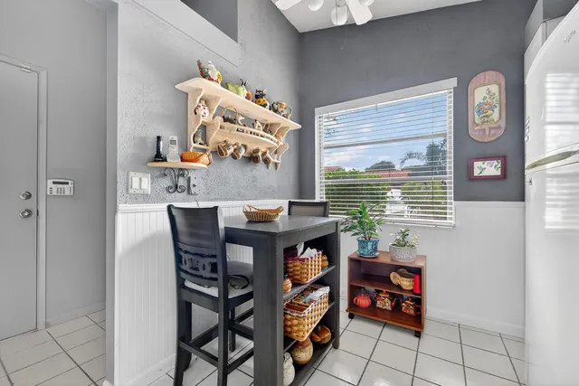 a room that has a table and a chair in it