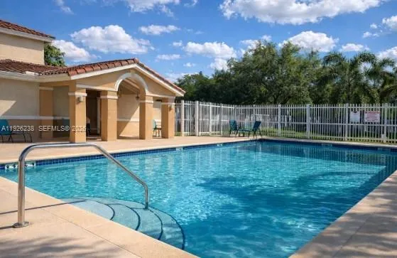 a view of swimming pool with a yard