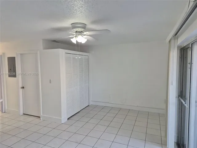 a view of a livingroom with a chandelier fan