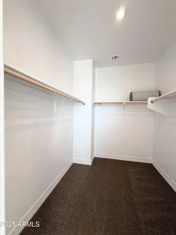 a view of storage and utility room with empty racks