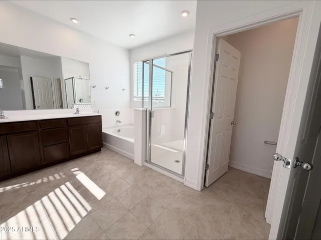a bathroom with a double vanity sink and mirror