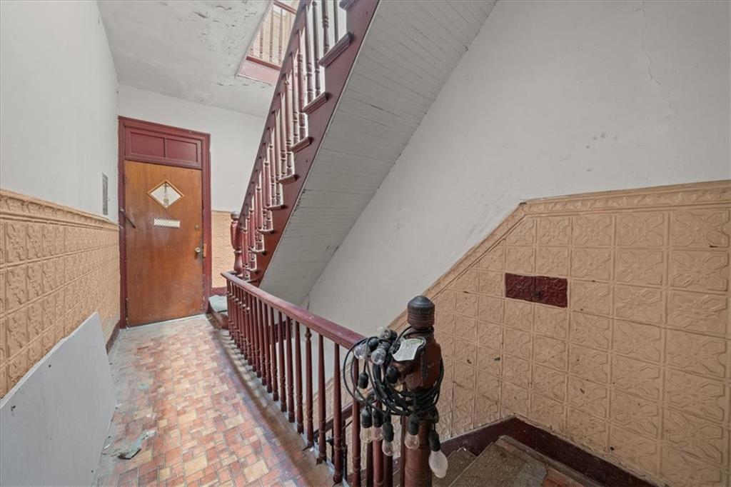 245 Bond Street Brooklyn, NY 11217 - Photo 8 of 11 a view of staircase with wooden floor and stairs