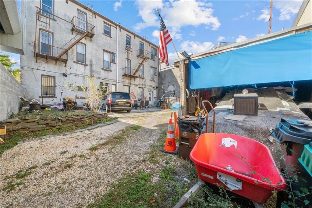 245 Bond Street Brooklyn, NY 11217 - Photo 10 of 11 a backyard of a house with outdoor seating