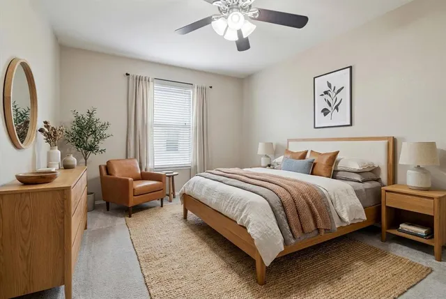 a bedroom with bed and a chandelier
