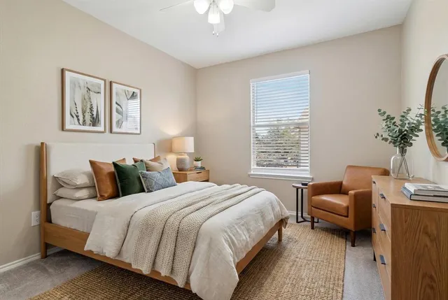 a bedroom with a bed and a couch