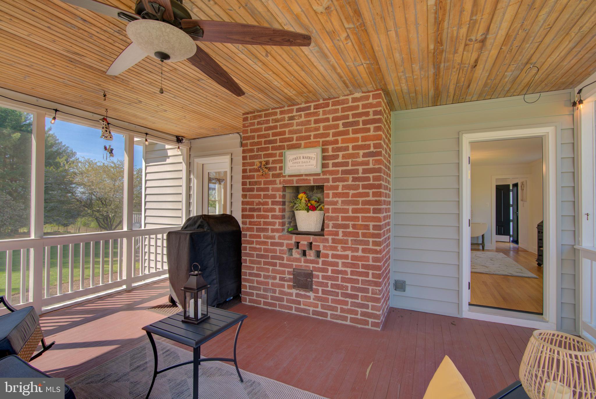 19411 Shelburne Glebe Road Leesburg, VA 20175 - Photo 42 of 58 Fireplace on screened in porch