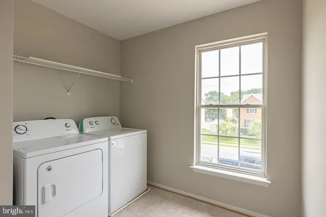 a view of storage and utility room with washer and dryer