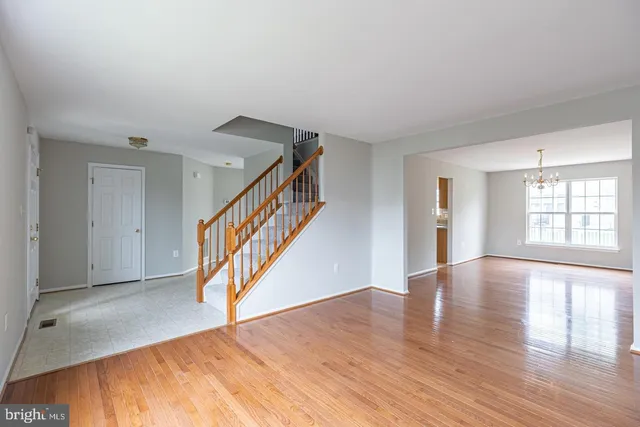 a view of an entryway with wooden floor