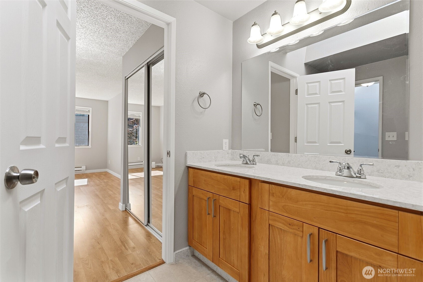 1802 Maple Lane, Unit A5 Kent, WA 98030 - Photo 15 of 27 a en suite bathroom with a double vanity sink a mirror and shower