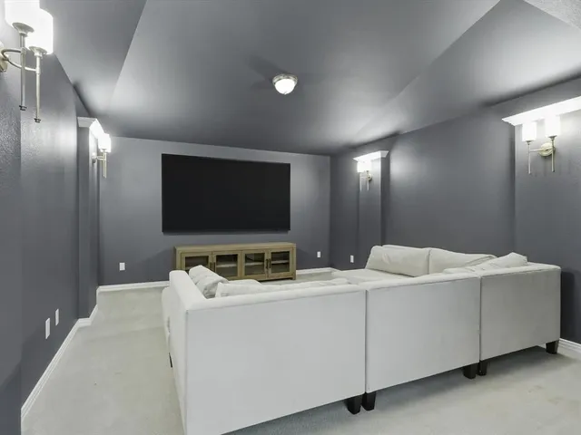 a room with furniture and flat screen tv