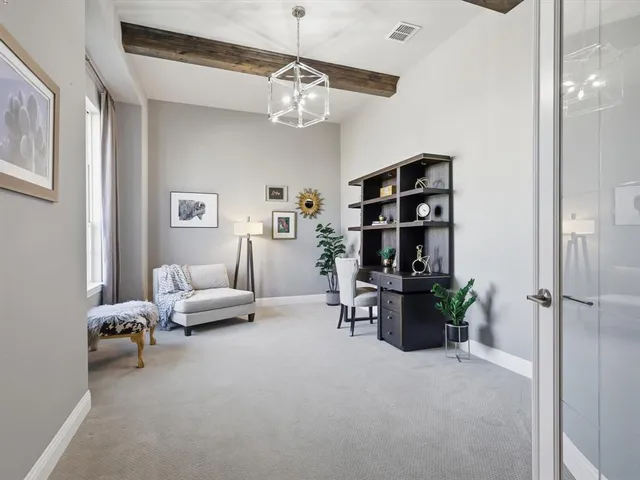 a living room with furniture and chandelier