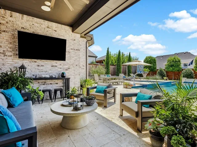 a living room with fireplace furniture and a flat screen tv