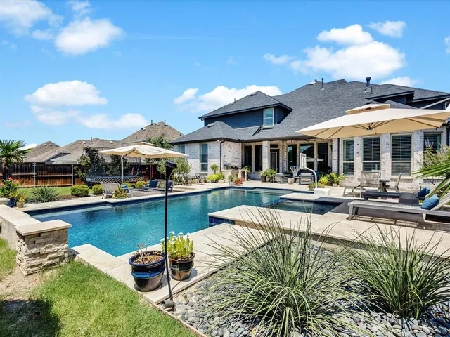 a view of a swimming pool with a patio