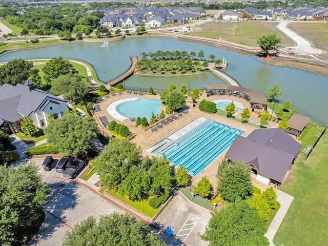 an aerial view of a house with a lake view