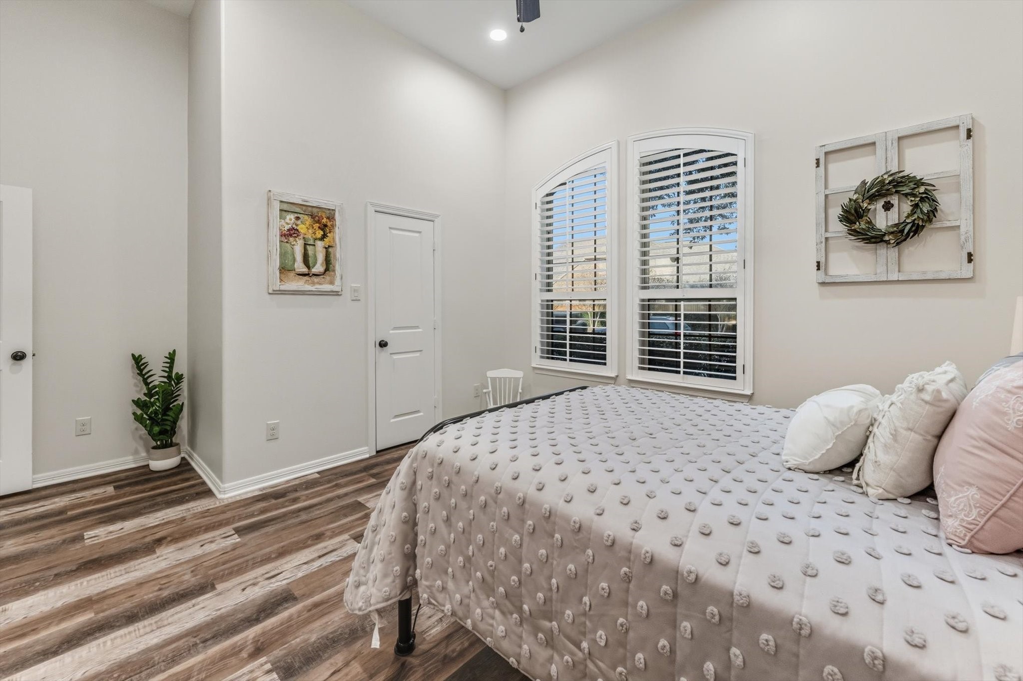 103 Fox Rindle Road Montgomery, TX 77316 - Photo 27 of 44 Number one of the two bright secondary bedroom highlighted by large windows that invite in natural light and create an airy atmosphere.