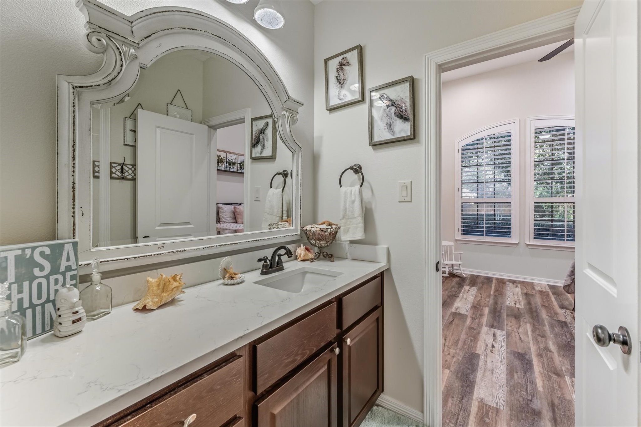 103 Fox Rindle Road Montgomery, TX 77316 - Photo 29 of 44 The Jack and Jill secondary bath connects the two bedrooms and has an extended vanity that provides ample counter space and functionality for daily routines.
