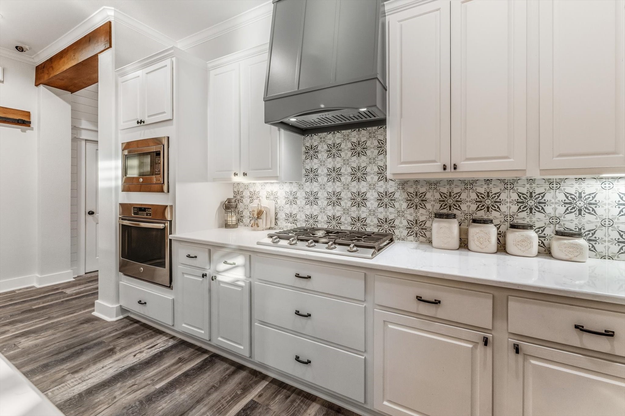 103 Fox Rindle Road Montgomery, TX 77316 - Photo 6 of 44 Designer tile backsplash pairs beautifully with premium appliances, and the refrigerator conveys for a seamless move in experience.
