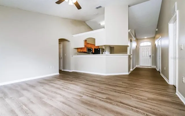 a view of a living room with a wooden floor