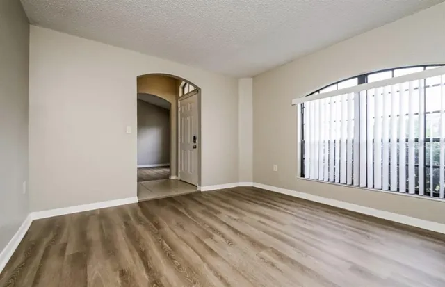 a view of a livingroom with wooden floor