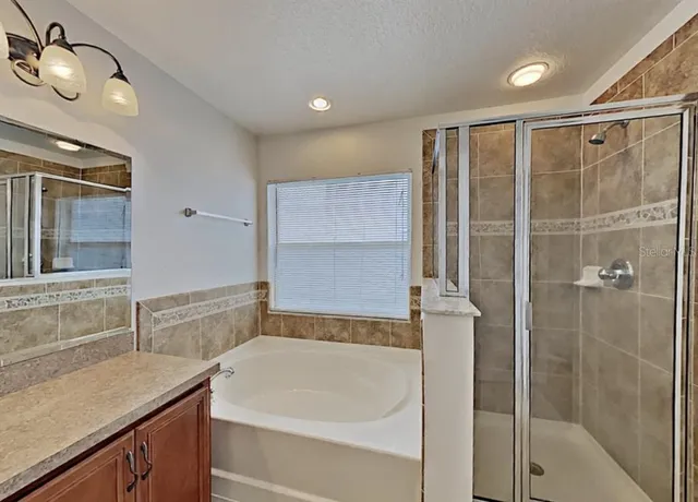 a bathroom with a bathtub and a sink