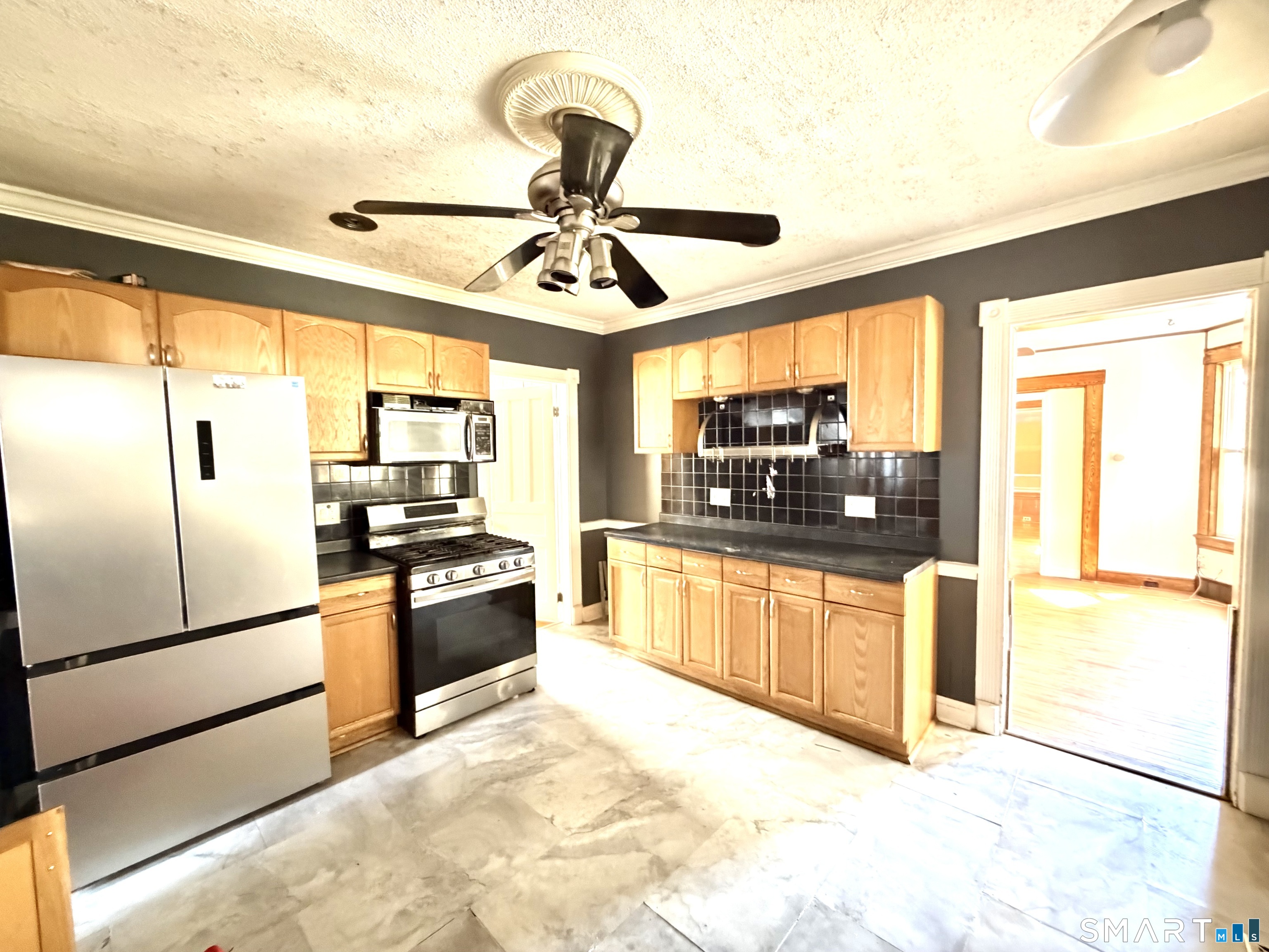 41-43 Washington Terrace Bridgeport, CT 06604 - Photo 15 of 18 a kitchen with stainless steel appliances granite countertop a refrigerator and a stove top oven