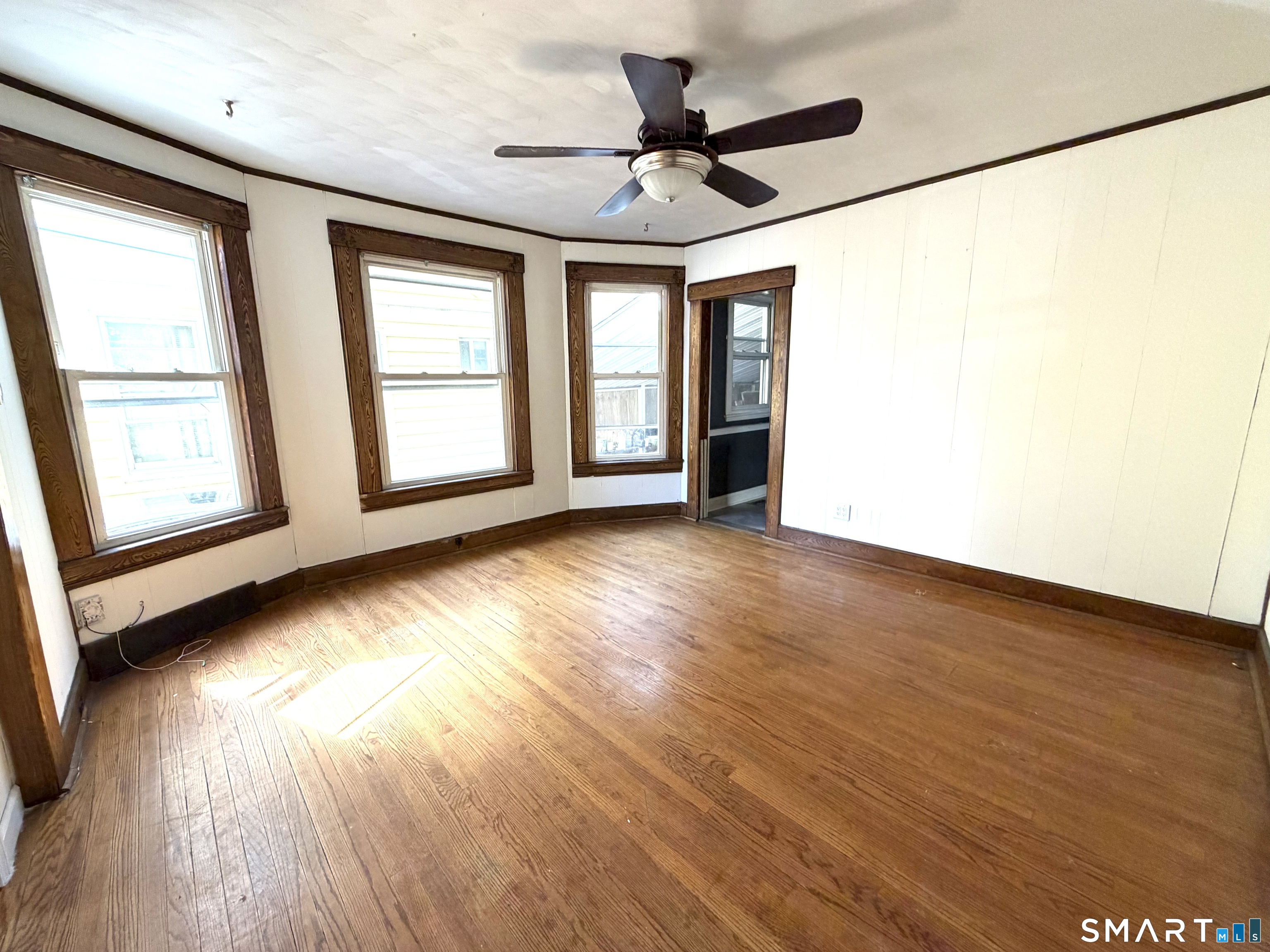 41-43 Washington Terrace Bridgeport, CT 06604 - Photo 17 of 18 a view of an empty room with wooden floor and a window