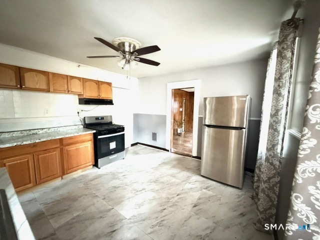 41-43 Washington Terrace Bridgeport, CT 06604 - Photo 6 of 18 a kitchen with stainless steel appliances granite countertop a refrigerator a stove and a sink