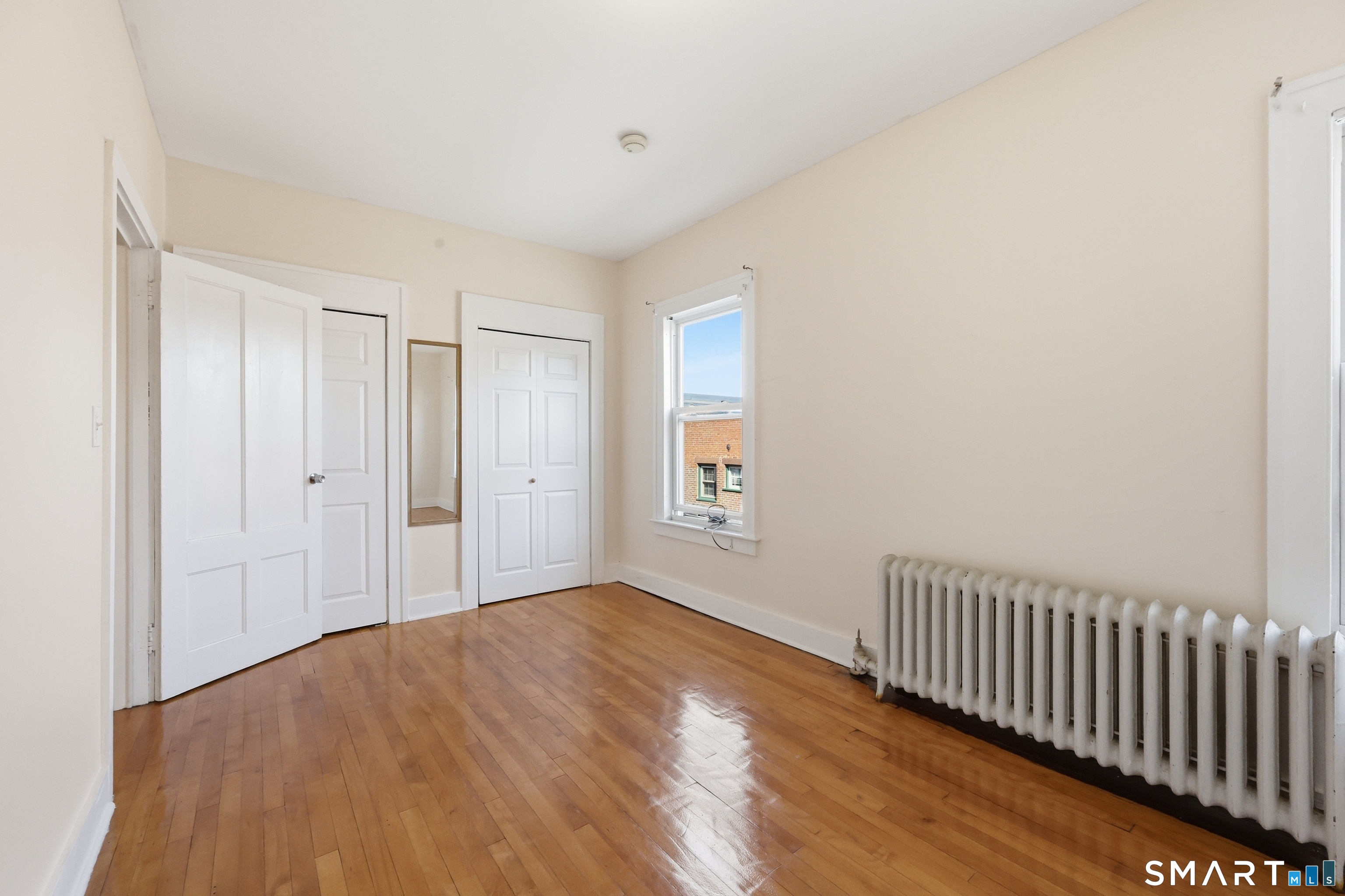 360 Main Street, Unit 3B Middletown, CT 06457 - Photo 9 of 21 a view of empty room with wooden floor