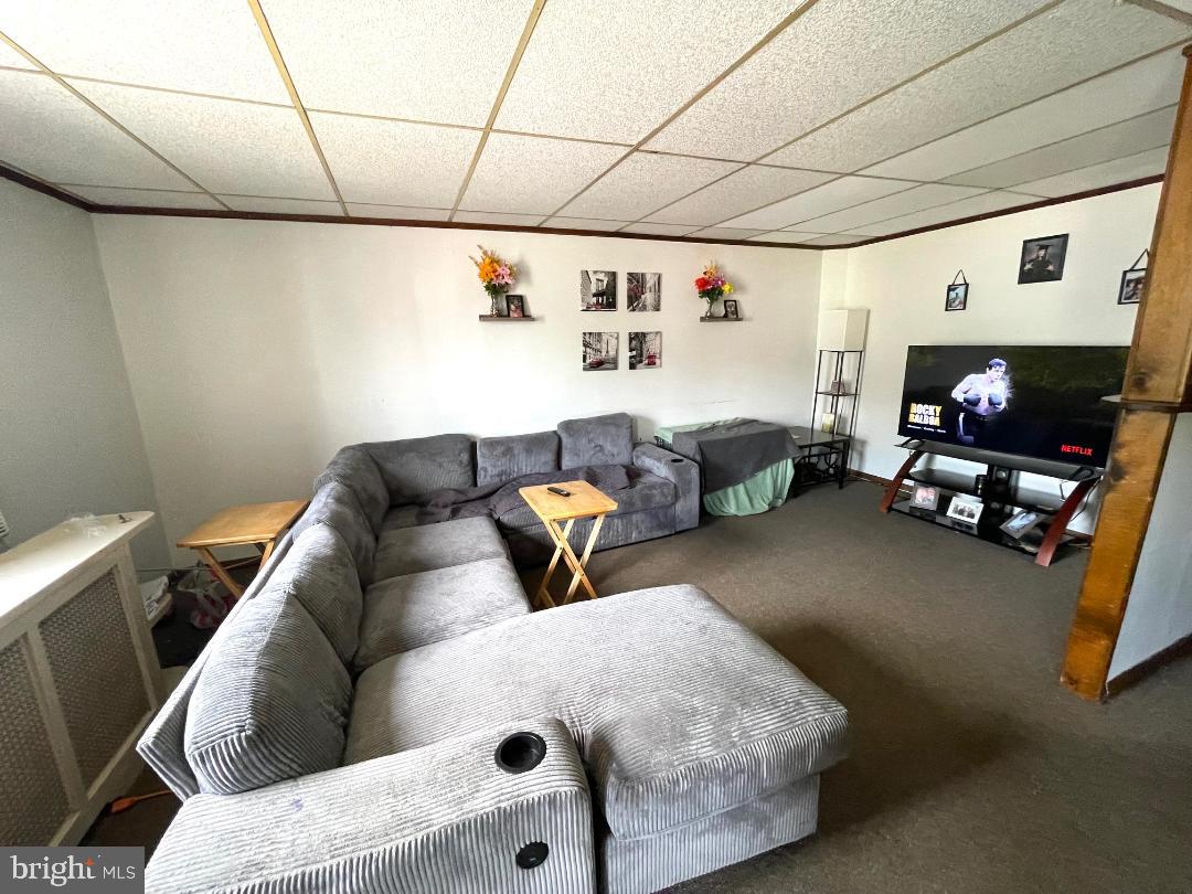 904-906 Main Avenue Croydon, PA 19021 - Photo 43 of 51 a living room with furniture and a flat screen tv