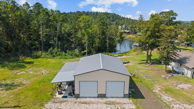 a aerial view of a house with a yard