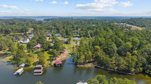 an aerial view of a houses with a lake view