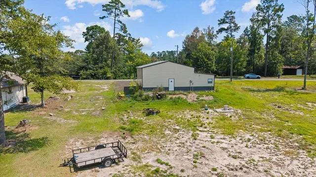 a view of a swimming pool with a yard