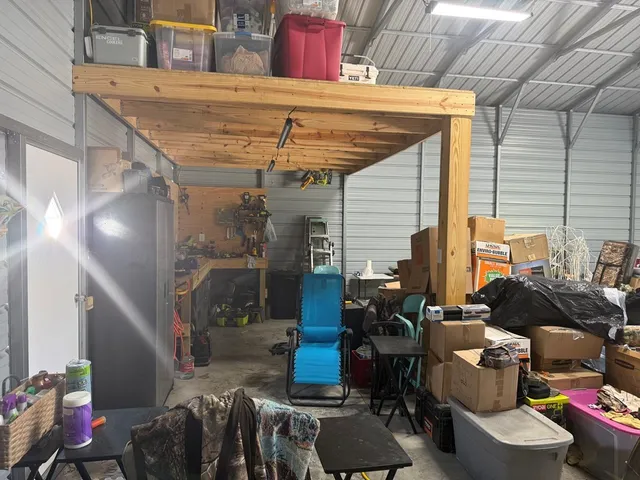 a front view of a house with outdoor seating