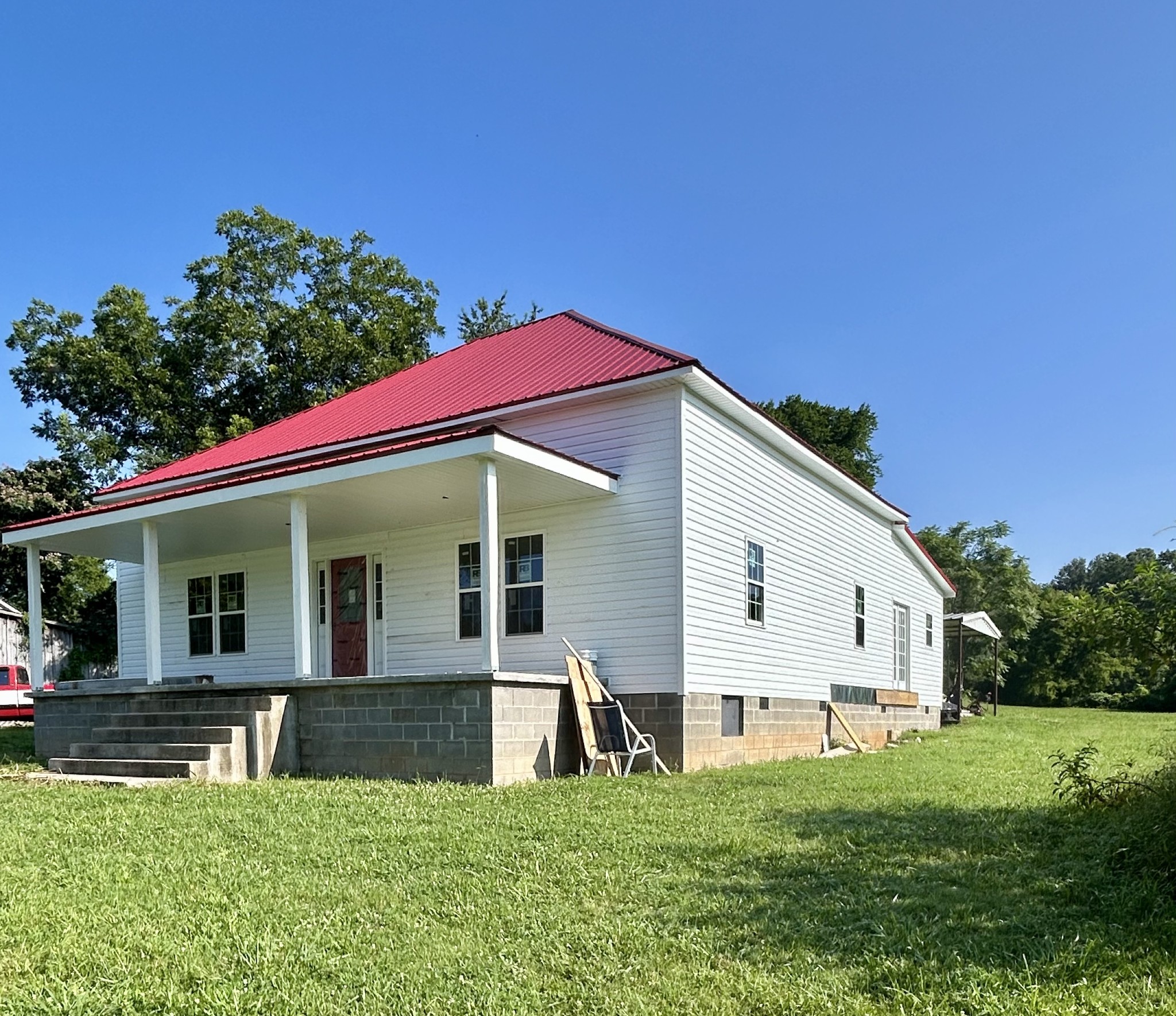 407 Main Street Prospect, TN 38477 - Photo 2 of 11 a view of a white house with a big yard