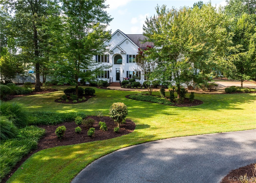 Mature landscaping with irrigation system and pave