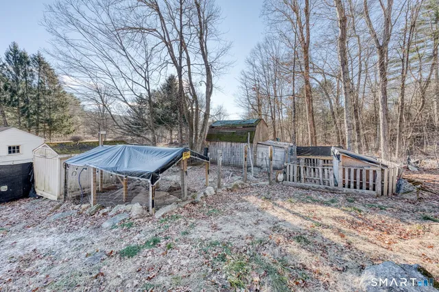 a view of a yard with snow on the road