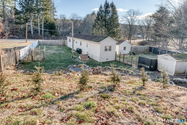 a view of a backyard with sitting area