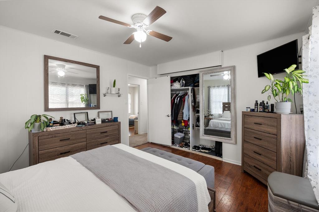 1704 Joyce Street Arlington, TX 76010 - Photo 11 of 19 a bedroom with a bed and a flat screen television