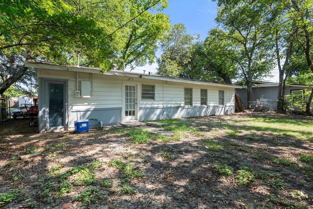 1704 Joyce Street Arlington, TX 76010 - Photo 17 of 19 a view of a house with backyard and sitting area