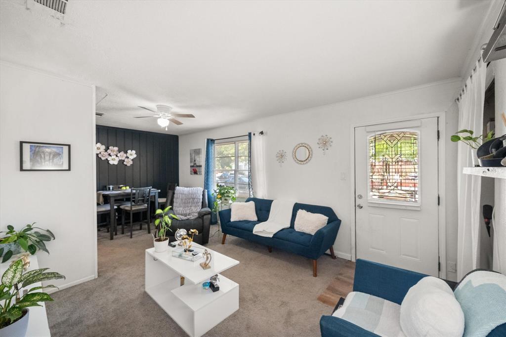 1704 Joyce Street Arlington, TX 76010 - Photo 5 of 19 a room with furniture a rug potted plant and a window