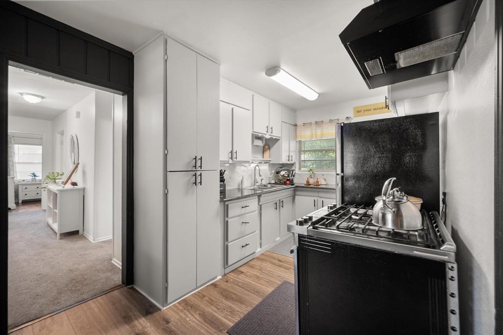 1704 Joyce Street Arlington, TX 76010 - Photo 8 of 19 a kitchen with refrigerator and window